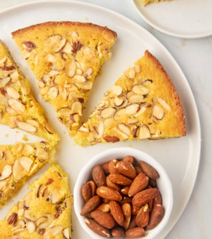 overhead view of slices of almond torte on a large white plate