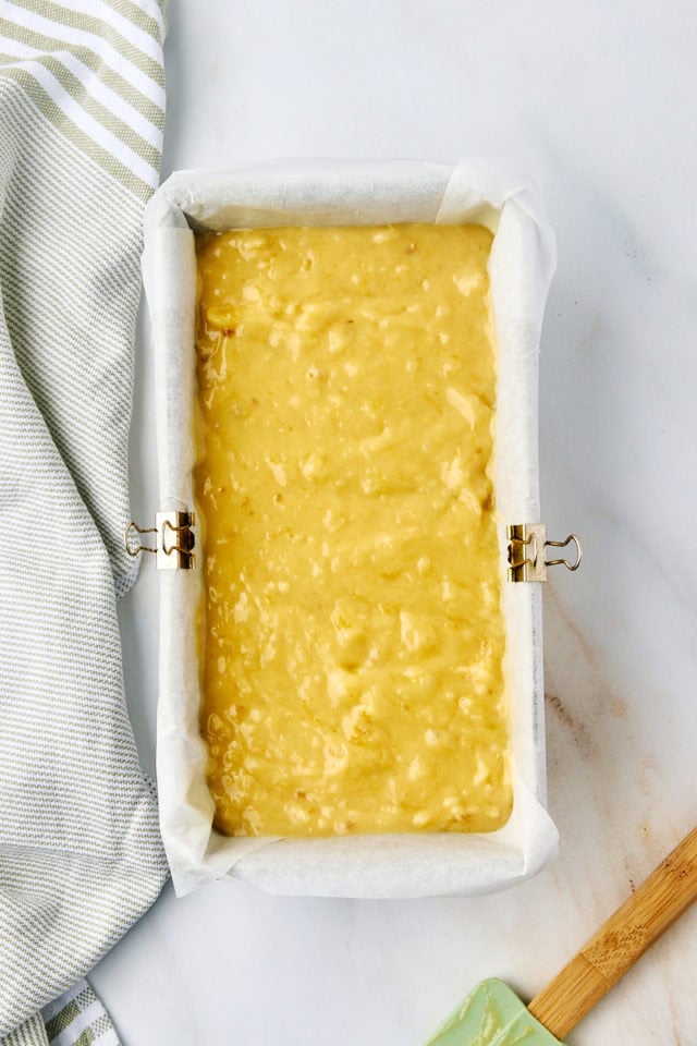 overhead view of banana bread batter in a loaf pan ready to go into the oven