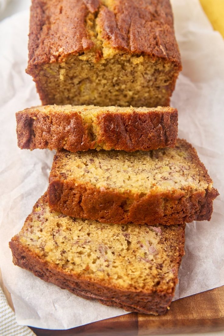 partially sliced banana bread on a cutting board