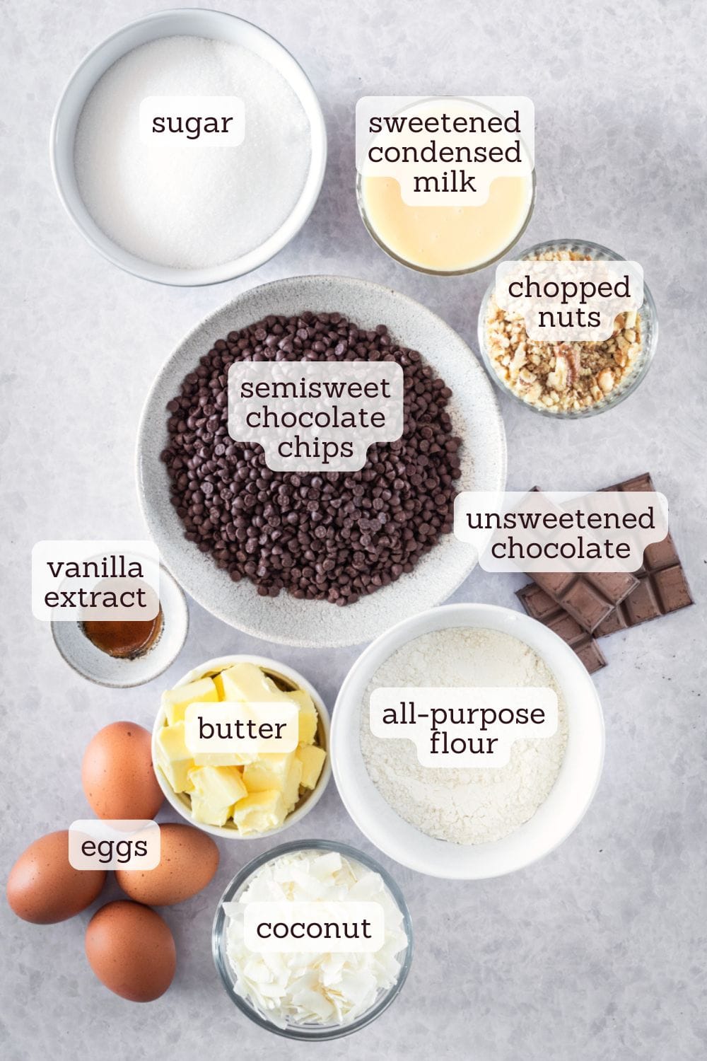 overhead view of labeled ingredients for caramel coconut pecan brownies