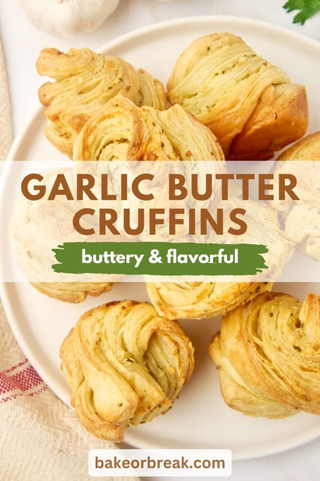 overhead view of garlic butter cruffins. on a white plate; text overlay "garlic butter cruffins buttery & flavorful bakeorbreak.com"