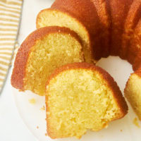 partially sliced Kentucky butter cake on a white cake plate