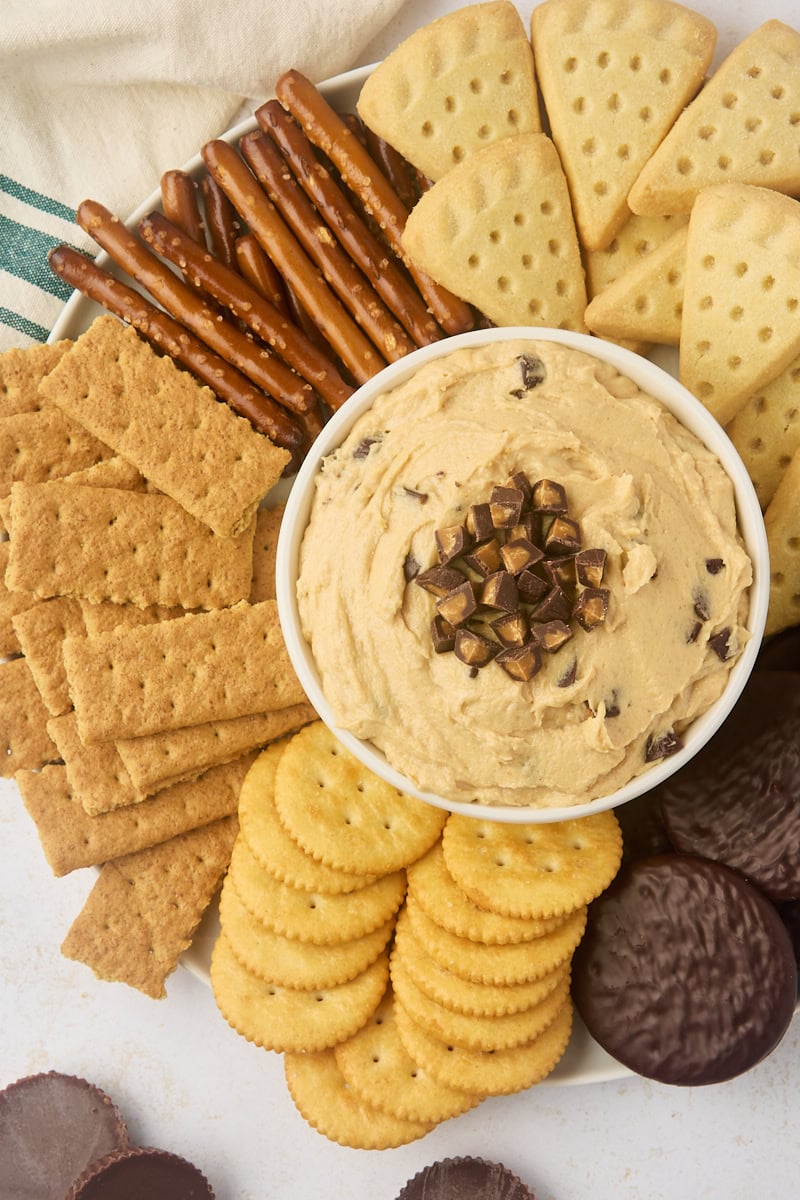 overhead view of peanut butter cup dip surrounded by pretzels, graham crackers, and cookies