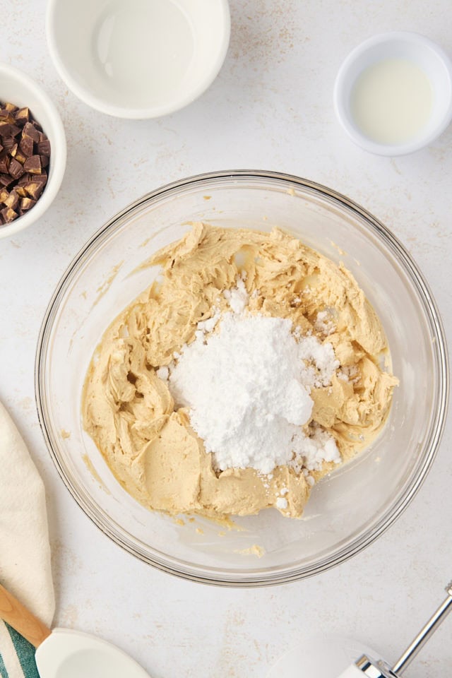 overhead view of confectioners' sugar added to cream cheese/peanut butter mixture