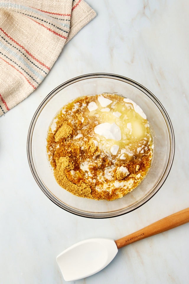 overhead view of graham cracker crust ingredients in a glass bowl