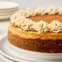 snickerdoodle cheesecake on a silver cake plate