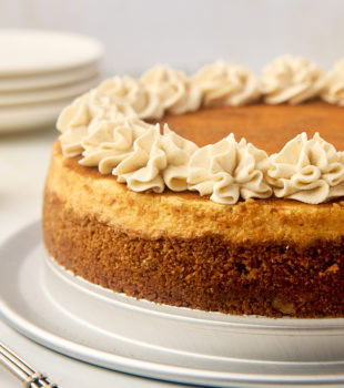 snickerdoodle cheesecake on a silver cake plate