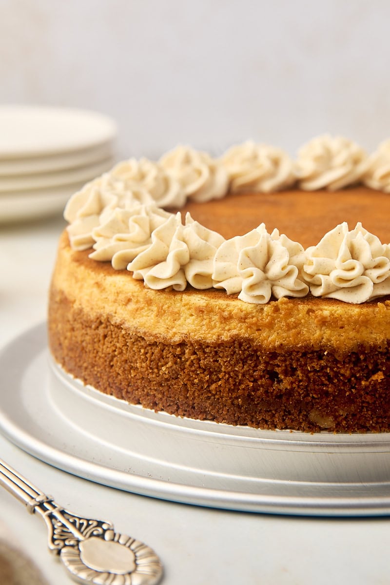 snickerdoodle cheesecake on a silver cake plate