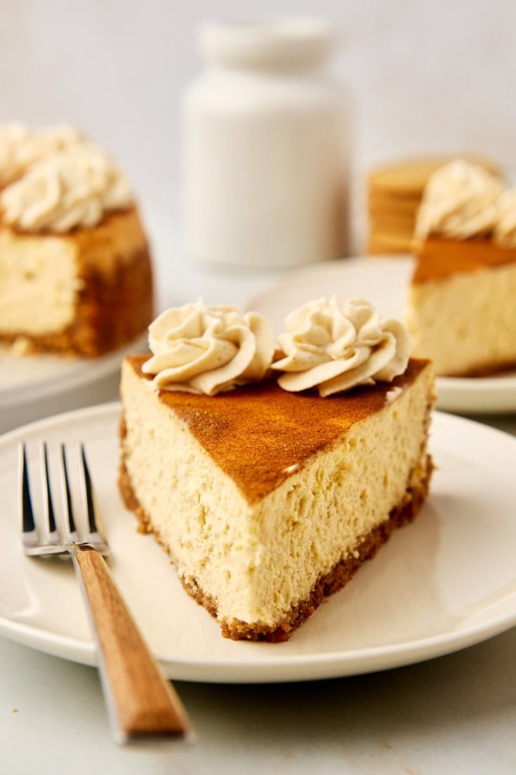 a slice of snickerdoodle cheesecake on a plate with a fork