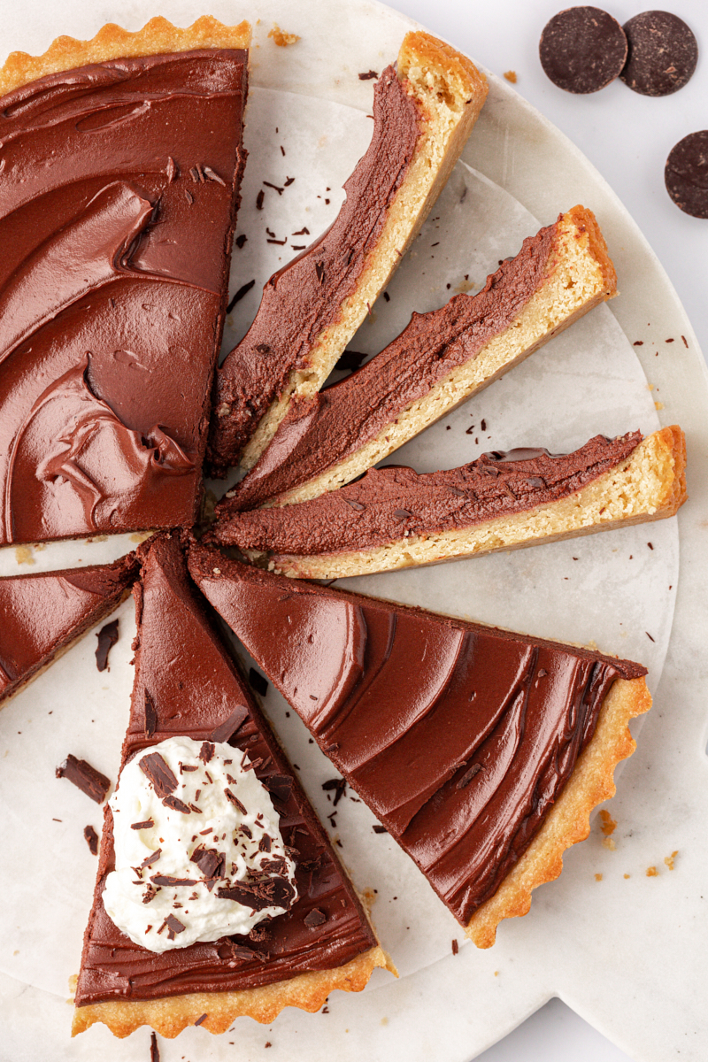 overhead view of partially sliced chocolate mascarpone tart