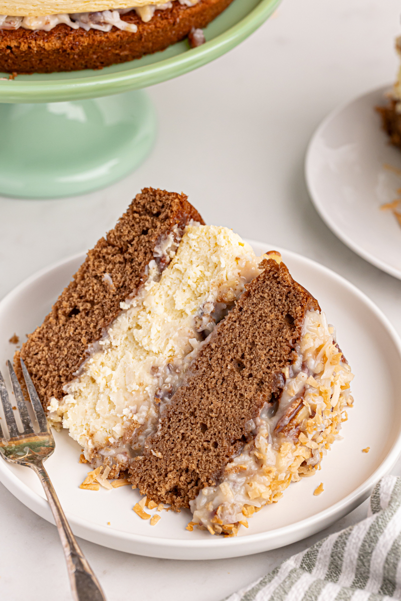 Slice of German chocolate cheesecake on plate with fork