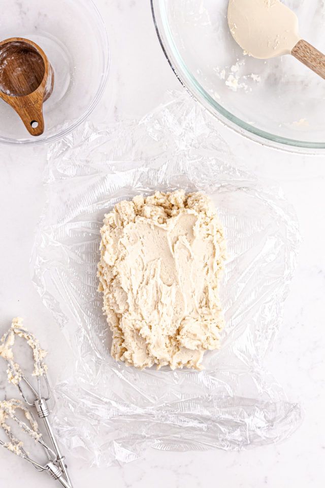 overhead view of Linzer cookie dough on a sheet of plastic wrap