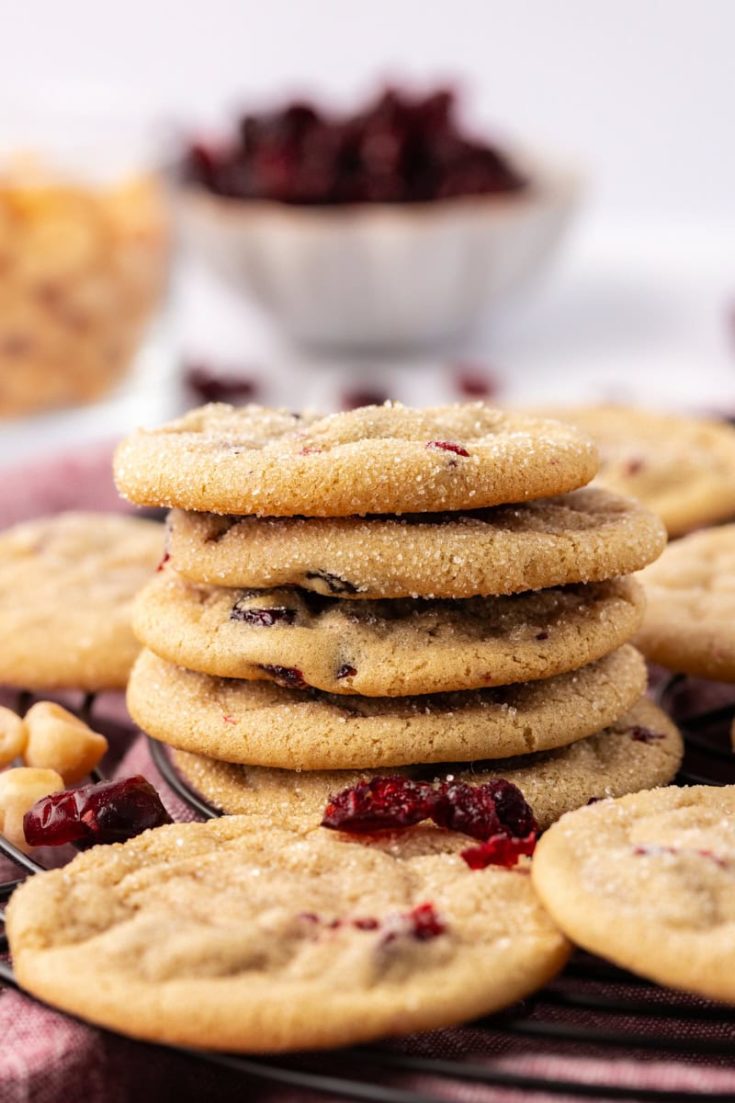 stack of macadamia butter cookies surrounded by more cookies