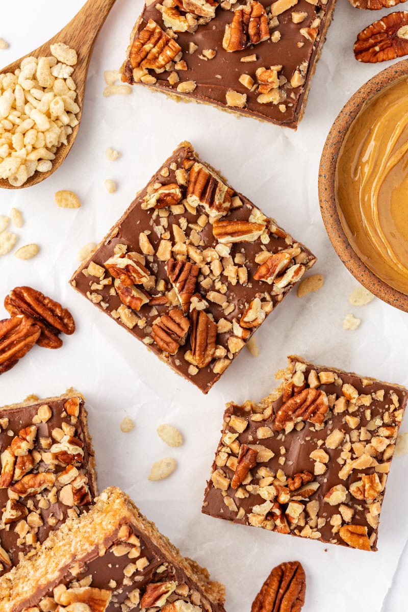 overhead view of chocolate peanut butter cereal bars on parchment paper