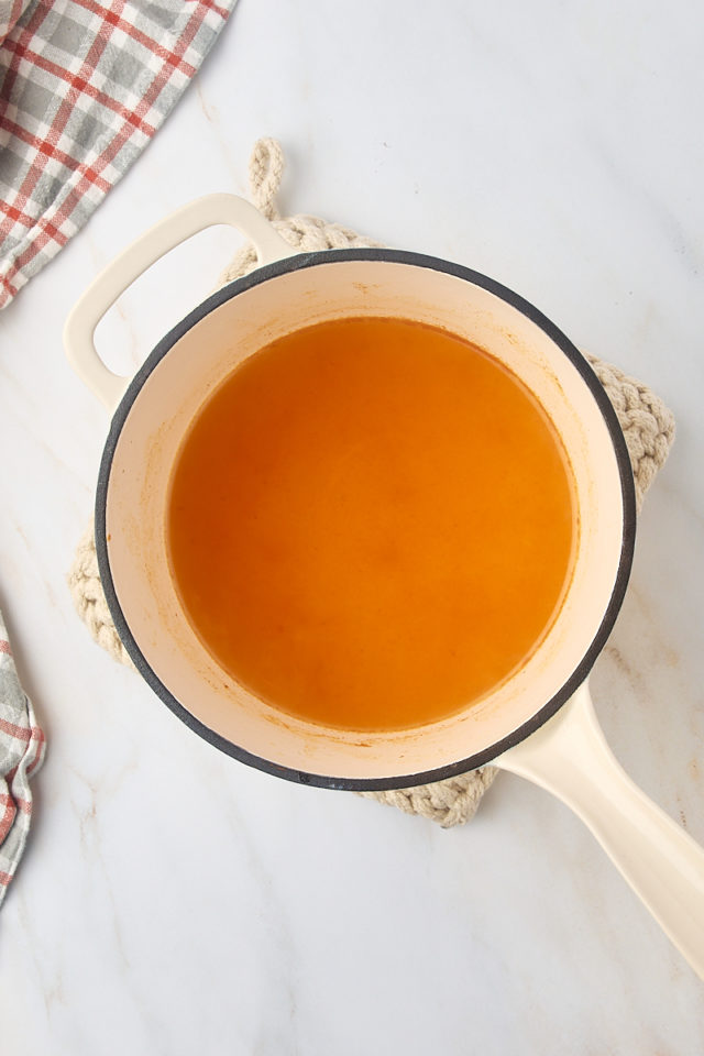 overhead view of reduced apple cider in a saucepan