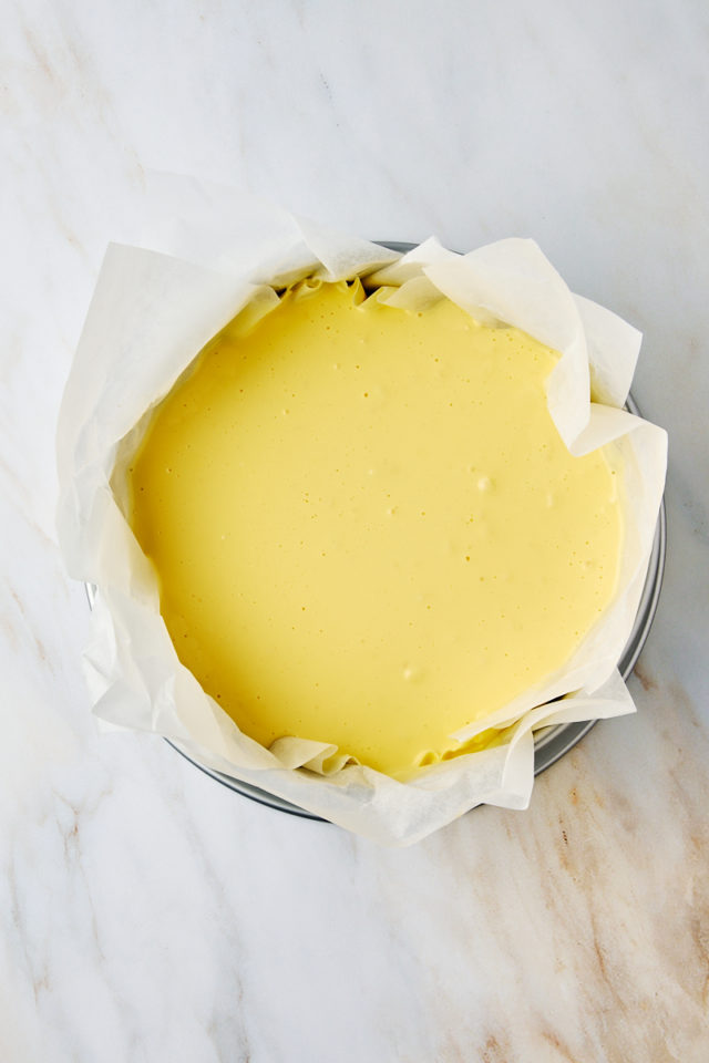 overhead view of basque cheesecake batter in a springform pan ready to go into the oven