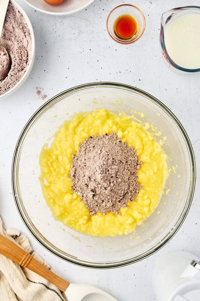 overhead view of dry ingredients added to mahogany cake batter