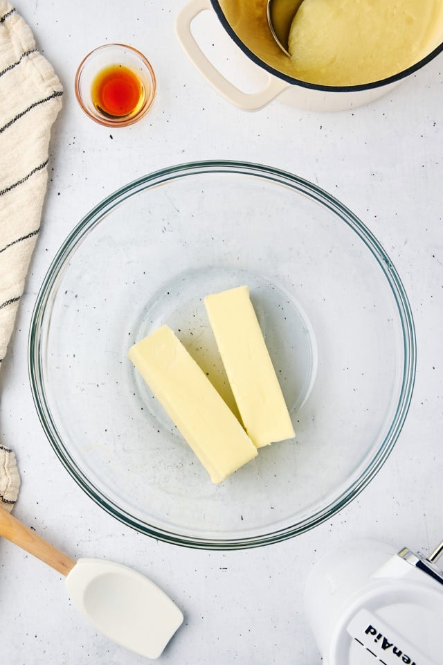 overhead view of butter in a glass mixing bowl