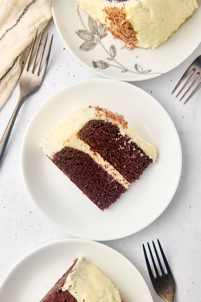 overhead view of mahogany cake on white plates