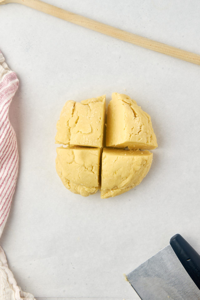 overhead view of raspberry ribbon cookie dough divided into four portions