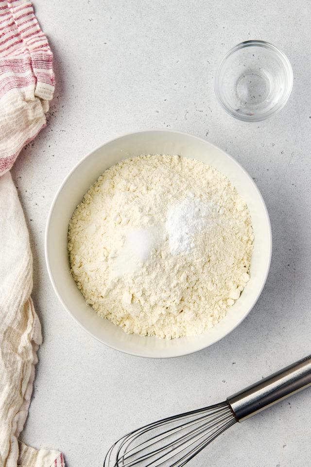 overhead view of flour, baking powder, and salt in a bowl