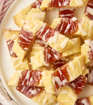 overhead view of raspberry ribbon cookies on a large white plate