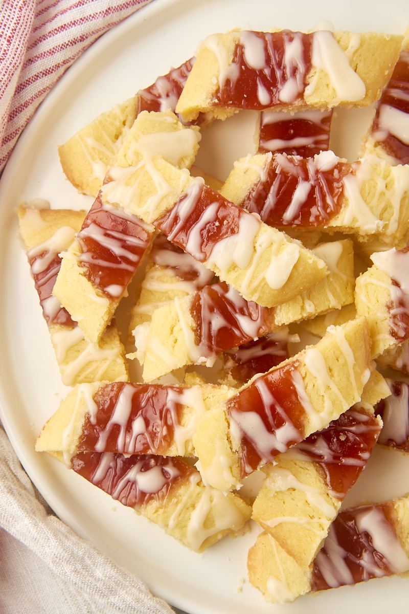 overhead view of raspberry ribbon cookies on a large white plate