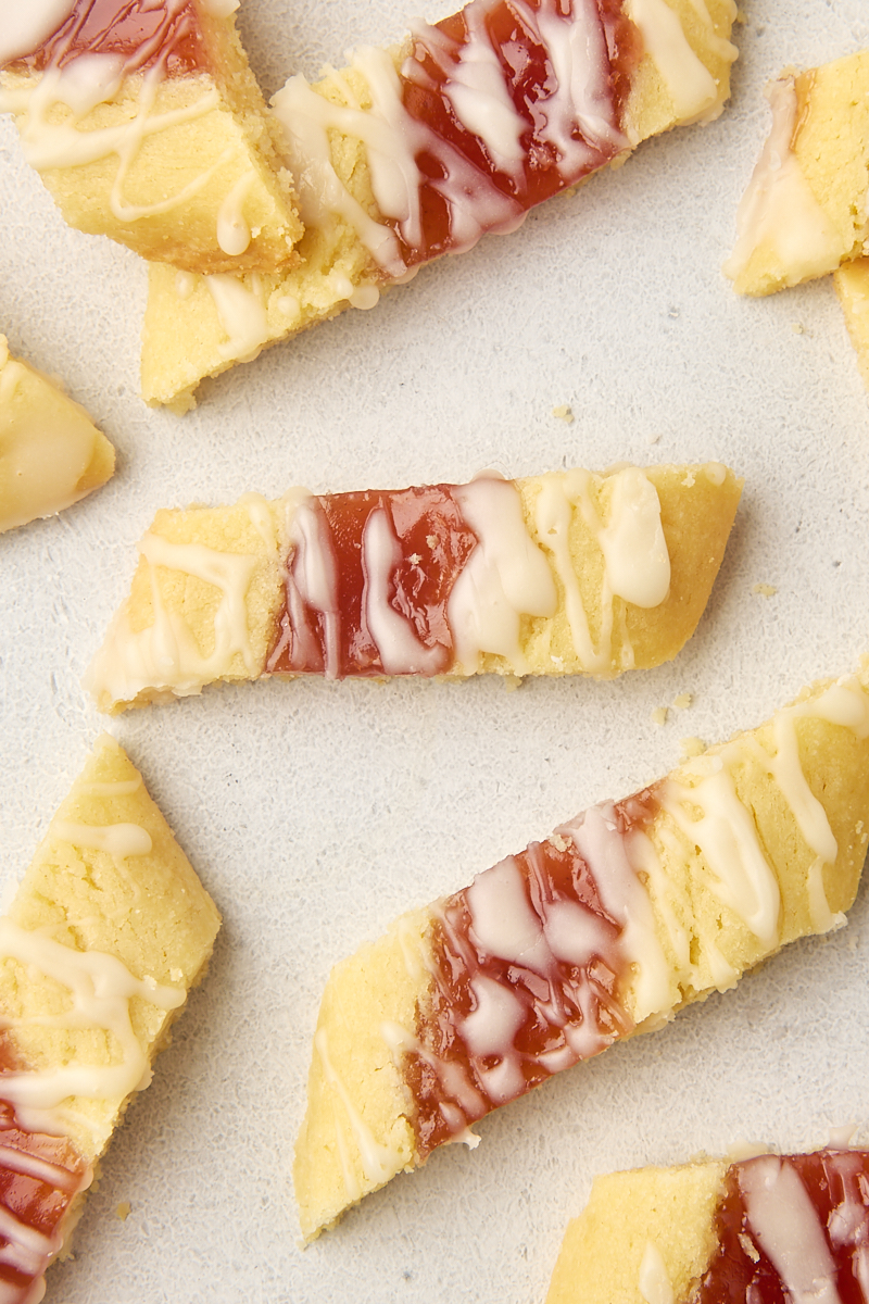 overhead view of raspberry ribbon cookies on a white countertop