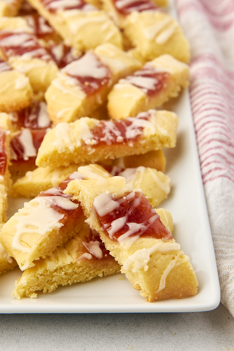 raspberry ribbon cookies on a long white serving plate