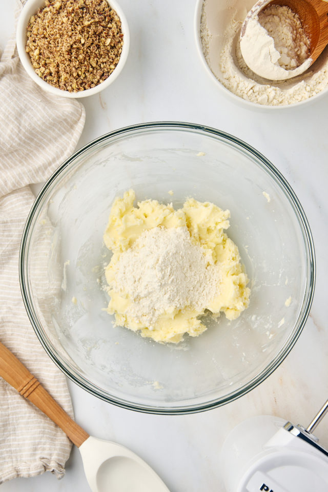 overhead view of dry ingredients added to creamed butter and sugar