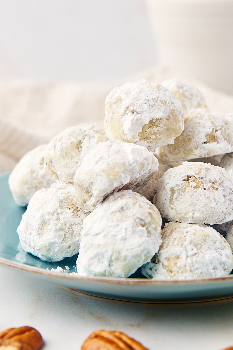 snowball cookies on a blue-green plate