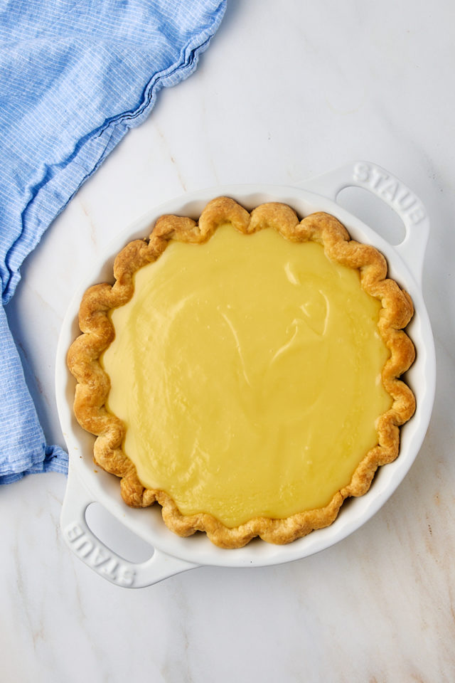 overhead view of assembled sugar cream pie in a white pie plate