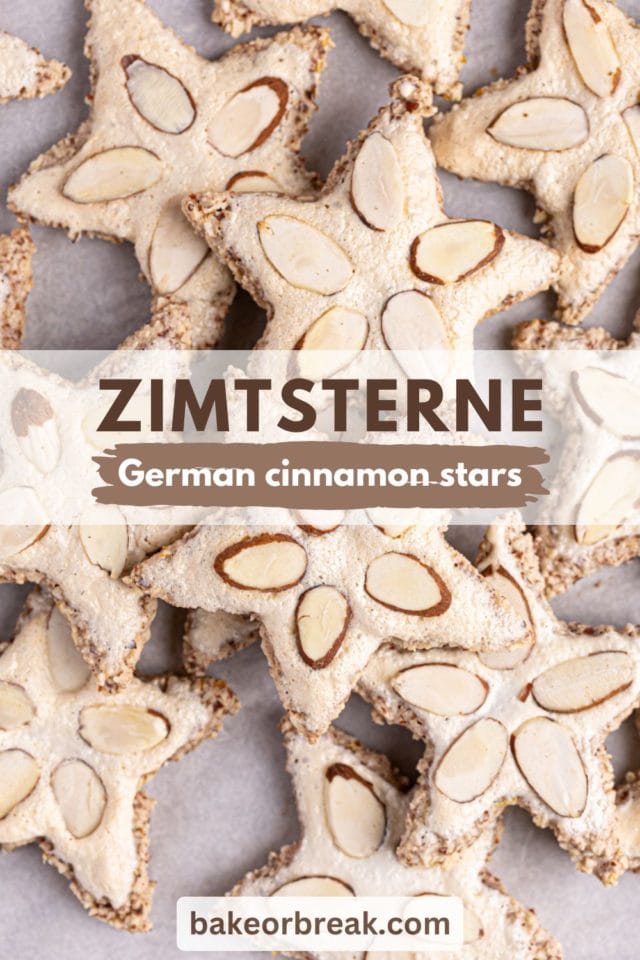 overhead view of zimtsterne cookies scattered on parchment paper; text overlay "zimtsterne German cinnamon stars)"