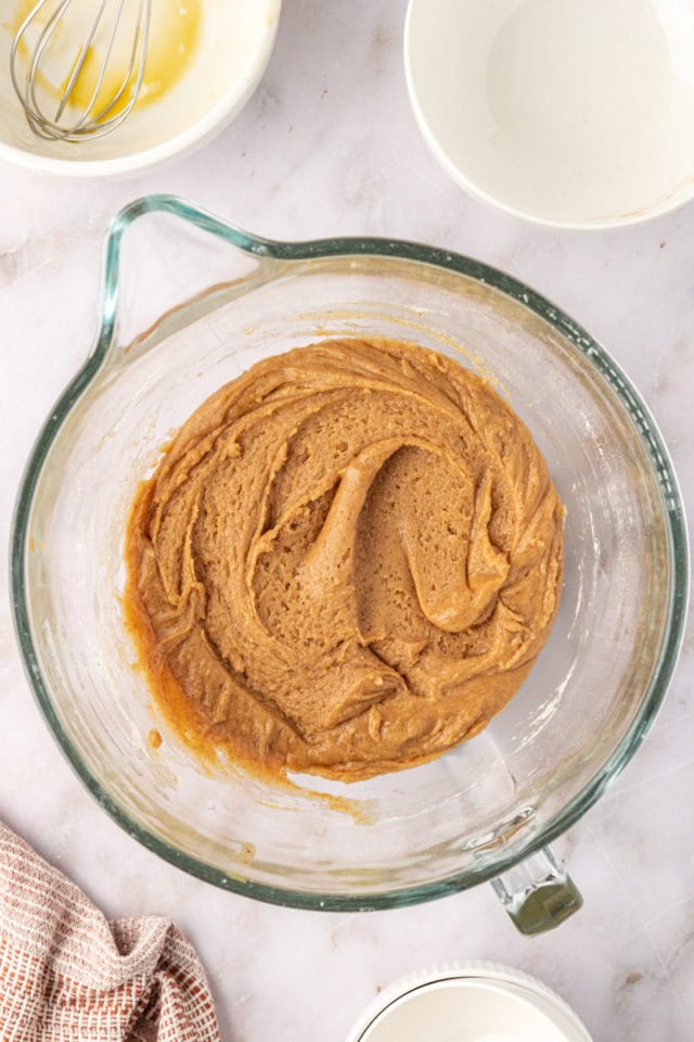 overhead view of brown butter snickerdoodle cookie dough in a mixing bowl