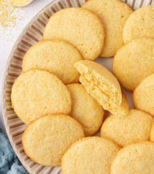 overhead view of cornmeal cookies on a large plate