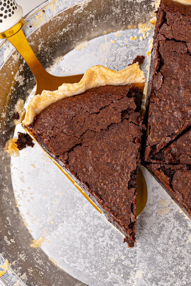 a slice of hot fudge pie on a pie server