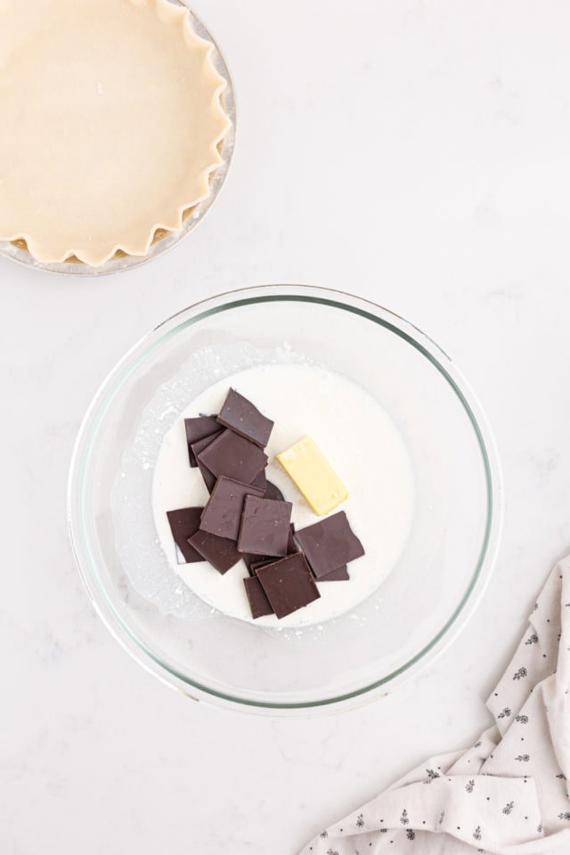 overhead view of chocolate, butter, and half-and-half in a mixing bowl