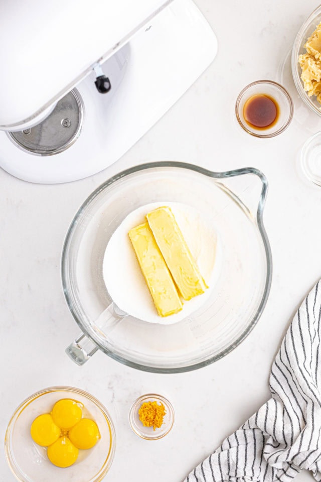 overhead view of butter and sugar in the bowl of a stand mixer