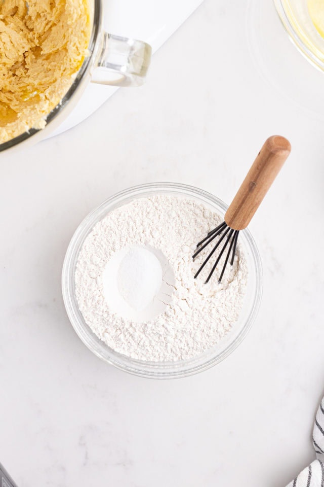 overhead view of flour and salt in a mixing bowl