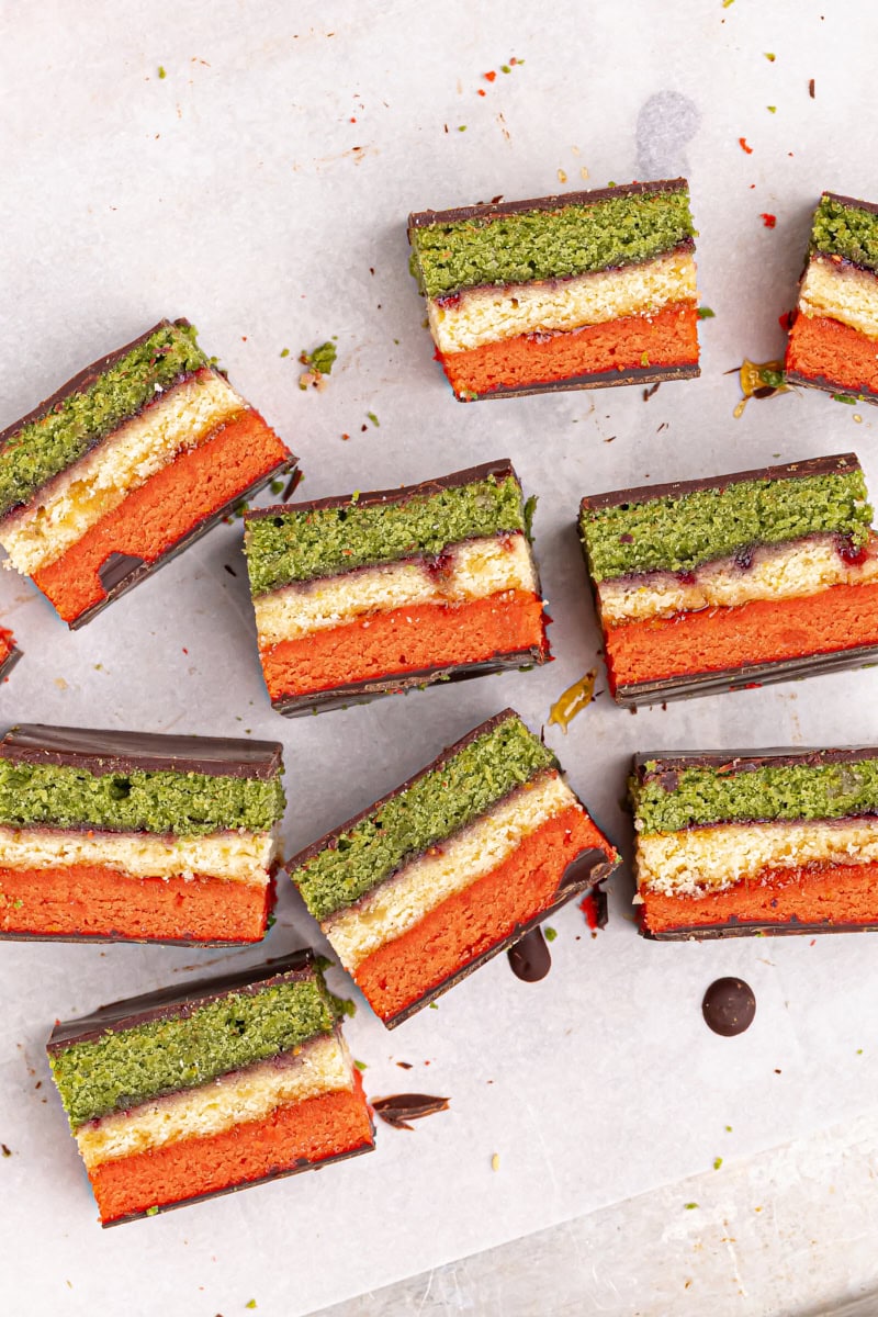 overhead view of Italian rainbow cookies on their sides on parchment paper