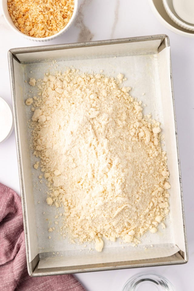 overhead view of macadamia shortbread dough in a baking pan