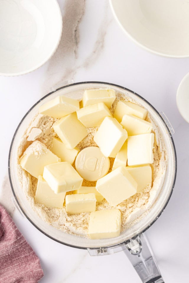 overhead view of butter added to dry ingredients for macadamia shortbread