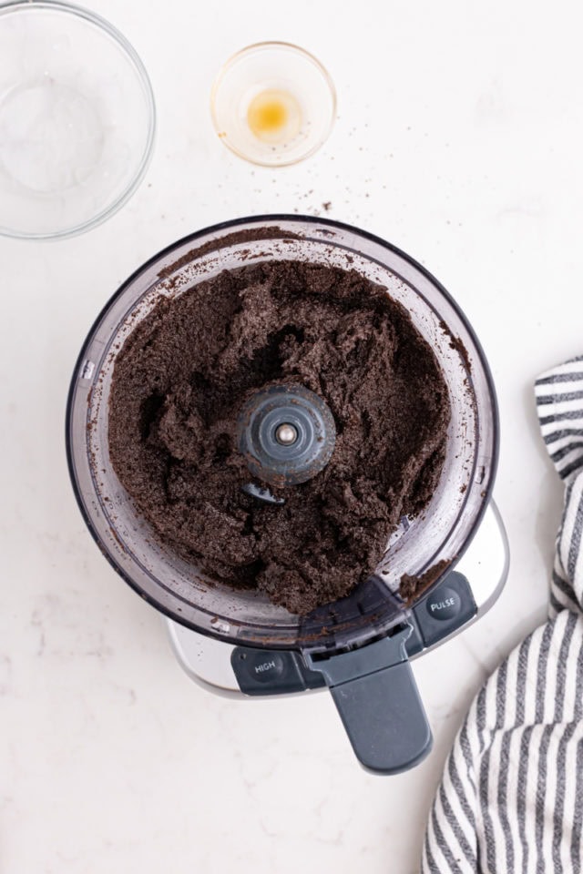 overhead view of Oreo truffles mixture in the bowl of a food processor