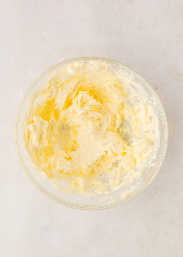 overhead view of creamed butter and confectioners' sugar