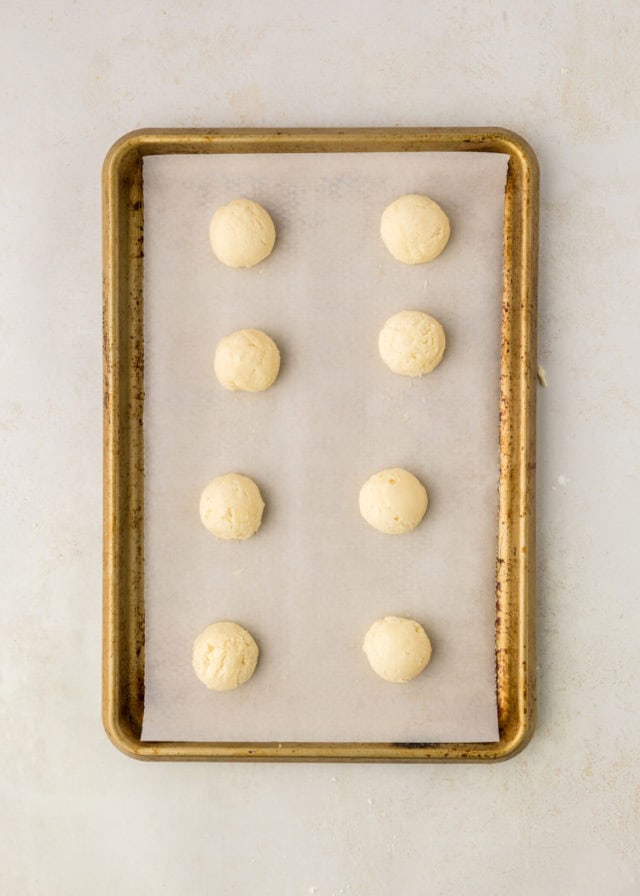 overhead view of peppermint meltaway cookie dough on a baking sheet ready to go into the oven