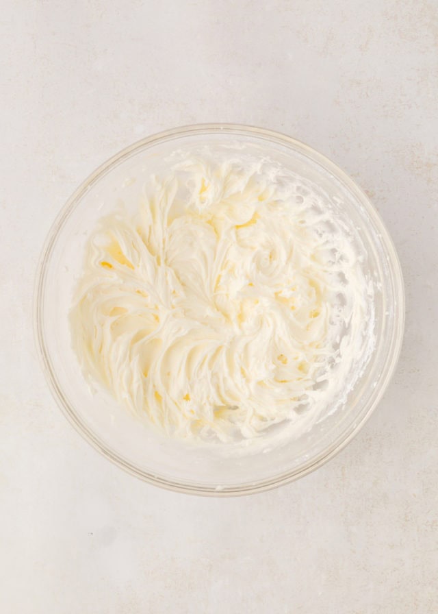 overhead view of peppermint frosting in a mixing bowl