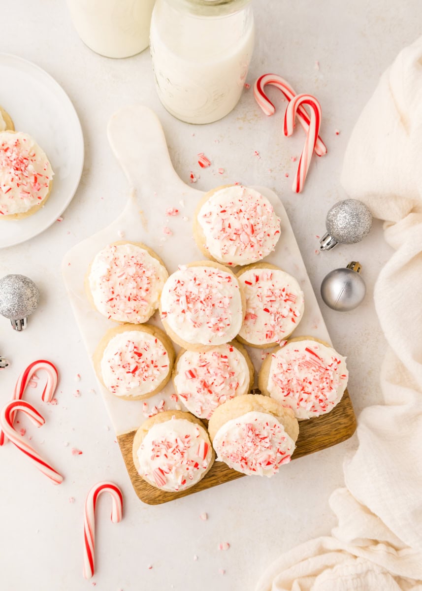 overhead view of frosted peppermint meltaways on a marble and wood serving board