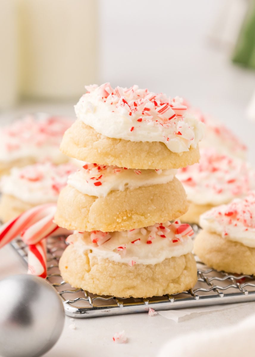 stack of three peppermint meltaways with more cookies in the background