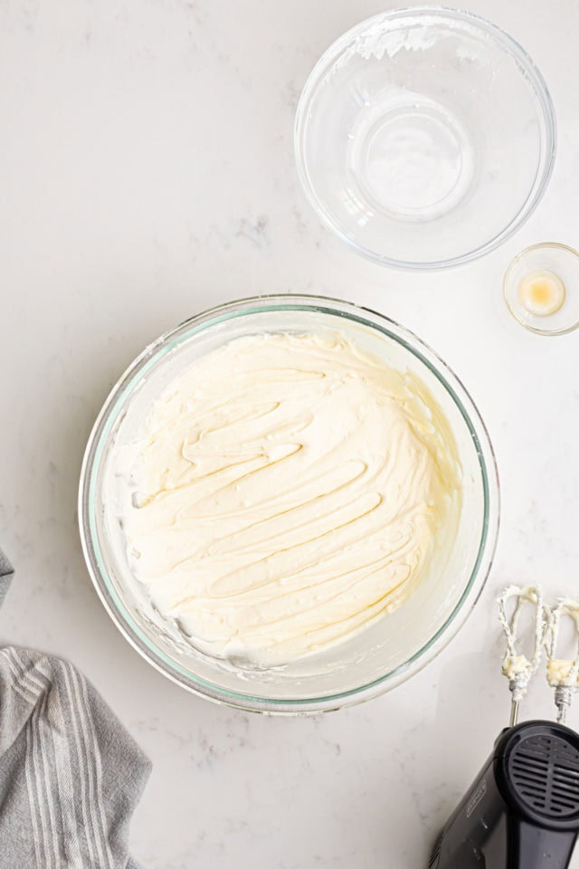 overhead view of cream cheese frosting in a mixing bowl