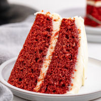 a slice of red velvet cake on a white plate